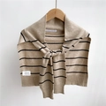 Close-up of striped knit shawl with material labels showing polyester and wool blend - Brown Stripes