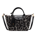 Leopard print faux fur handbag in grey and black with leather strap and handles - Black
