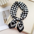 Elegant black and white checkerboard silk scarf tied in a stylish knot design - 70cm / Black & White Checkerboard