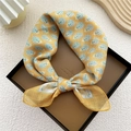 Yellow paisley cotton-linen scarf tied on a display box with detailed floral patterns - Yellow Peacock Feather Pattern