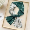 Elegant dark green and beige skinny silk scarf with geometric chain pattern tied in a bow - Green Sprout Dots (25X)
