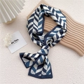 Long navy and white silk-like scarf with geometric V-shaped patterns on wood board - Willow Leaf Stripe