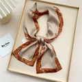 Elegant beige silk-like skinny scarf with orange floral and polka dot border details - Orange Dianthus Frame (4X)