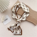 White narrow silk scarf featuring vintage brown horse print and golden chain details - Pony Belt Grid Beige