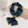 Deep teal silk scarf featuring golden chain and horse pattern with yellow piping - Pony Belt Grid Lake Blue
