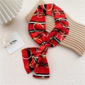 Red silk skinny scarf with geometric chain pattern displayed on a wooden board - Striped Metal Ring Red