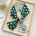 Fashionable twilly scarf featuring green floral and houndstooth print in a tied bow style - Green Circular Floral (12X)