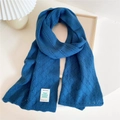 Peacock blue knitted scarf with wave hollow pattern and white brand label detail - Peacock Blue
