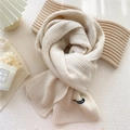 Chunky knit scarf in cream beige with textured weave and small woven brand label - Cream