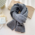 Deep grey chunky knit scarf with block weave pattern on wooden decorative board - Gray