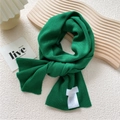 Chic green knitted scarf for women in soft texture displayed on a white art desk - 22x150cm / Green Leaves