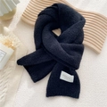 Chic black knitted scarf with white fabric label and soft warm plush texture for winter - Black