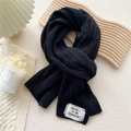 Thick black knitted scarf for women with woven label in a cozy aesthetic flatlay - 12.6x70.8 Inch / Black