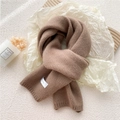 Chic knit winter scarf in brown with brand label on textured white background - Camel