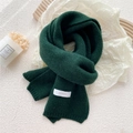Thick dark green knitted scarf with white brand label and soft warm texture - Green