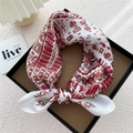 Silk square scarf with geometric patterns in red and pink, folded in a gift box - Alphabet Elephant Beige Base