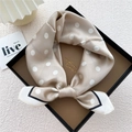 Champagne silk neck scarf with white polka dots and elegant contrast border tied in a bow - Frame Polka Dot Khaki