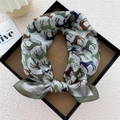 Silk square scarf with horse print in dark green and brown, presented in a gift box - Line Horse Shadow Green