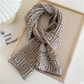 Knitted beige and brown winter scarf with geometric Greek key pattern in a stylish display - Coffee and Beige Maze