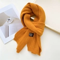 Chic mustard yellow knitted long scarf with ribbed texture and black fabric label detail - Orange Yellow (Brown Label)