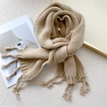 Thick knitted tassel scarf in light camel color for winter warmth and soft texture - Beige