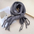 Deep grey chunky knit scarf with thick handmade tassel details and minimalist aesthetic - Gray