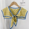 Yellow silk scarf with blue geometric waves and knot design on wooden hanger - Two-color Wave Yellow