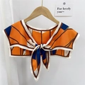 Geometric color-block scarf shawl in navy and orange with bow tie closure - Striped Geometric Orange