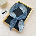 Blue floral skinny scarf made of chiffon tied as a bow for hair or bag decoration - Water Wave Floral Blue