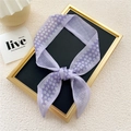 Narrow purple skinny scarf with floral and checkered pattern tied in a bow - Small Floral Grid Purple