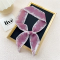 Narrow floral chiffon skinny scarf in purple and white, tied as a stylish accessory - Flying Feather Pink