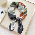 Artistic square silk scarf featuring multicolor graffiti print and knotted styling - 8 Grey Pegasus