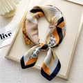 Silk-like square scarf featuring geometric orange and black patterns with clover motifs - 12 Khaki Clover Pattern