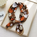 Brown floral silk scarf with orange and white flowers displayed in a golden frame - 15 Brown Floral U