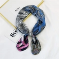 Blue and pink paisley patterned silk scarf tied in a bow on a white minimalist surface - Magenta Paisley Striped (17 Paisley Two-tone Magenta)