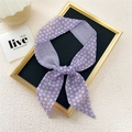 Narrow purple floral and plaid double-sided silk scarf tied as a bow on a display - Purple Small Floral Plaid