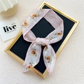 Pink narrow floral silk scarf tied in a bow with orange flowers on cream background - Pink Flower Diamond Dot