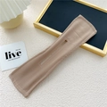 Close-up of khaki Deft Bun hair tool with flexible wire and premium fabric texture - Dark Khaki