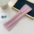 Detail of pink fabric hair bun maker tool with internal wire and stitching details - Pink