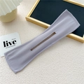 Detailed flat lay of lavender chiffon deft bun hair tool with central slot and neat stitching - Purple