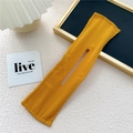 Detail of a bright yellow fabric deft bun hair maker with reinforced edge stitching - Orange Yellow