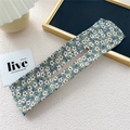 Floral print Deft Bun hair maker with white flower pattern on green fabric background - Five Petal Green