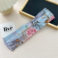 Detail of light blue floral chiffon hair bun maker with elegant pink rose patterns - Rose Leaf Blue