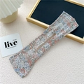Detail of floral fabric hair bun maker with a flexible wire core and central opening - Stylus Floral Beige