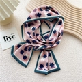 Pink narrow silk scarf with floral print and green border tied in an elegant knot - Pink Octagonal Print