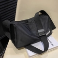 Versatile black nylon crossbody bag with adjustable strap and casual sporty design - Black