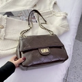 Quilted dark brown shoulder bag with gold twist lock and chain strap on white tweed - Brown