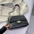 Classic black quilted chain crossbody bag with golden metal twist lock and leather strap - Black
