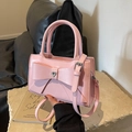 Pink bow shoulder bag with heart rhinestone and lychee texture on stone platform - Pink