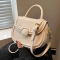 Elegant cream white faux leather saddle bag with gold hardware and adjustable strap - Off-white